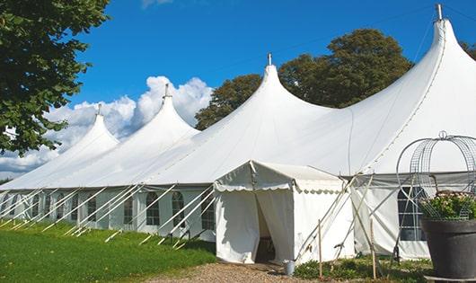 a group of luxury portable restrooms with individual stalls and running water in Dartmouth, MA